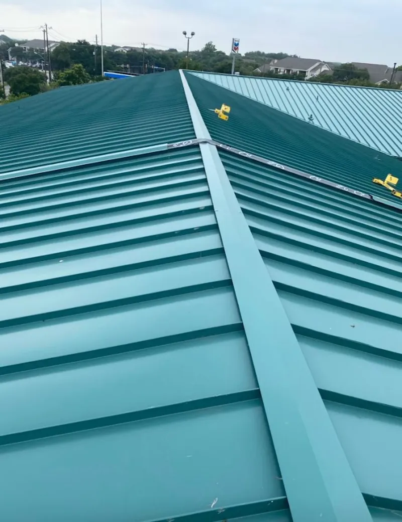 Green commercial metal roof ridge and valley for Metal Roof Repair in North Middleton